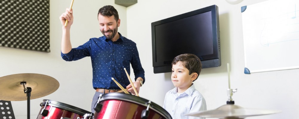 student and drum teacher